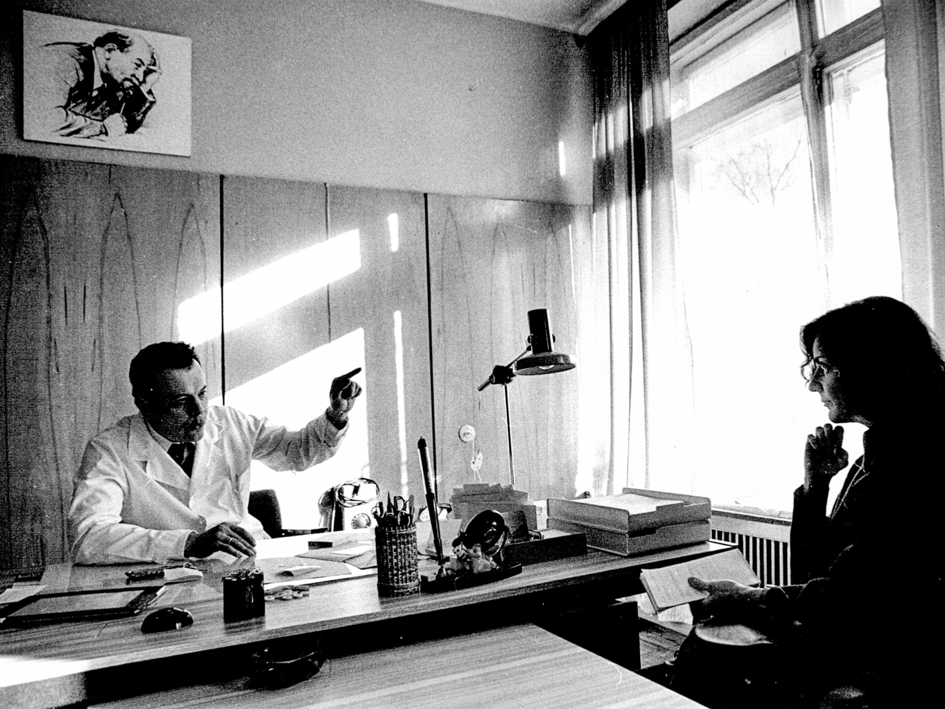 Ann Cooper interviewing a doctor in the USSR.