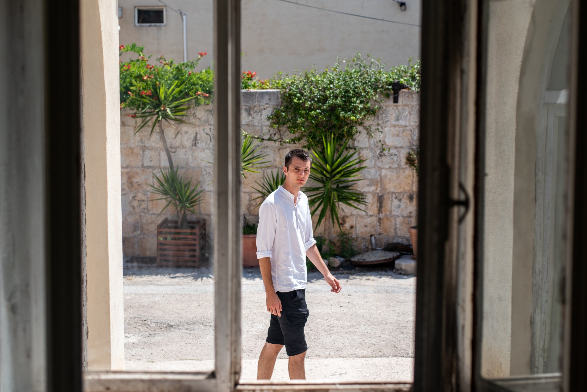 Artist Dejan Krstić outside of his exhibition space in Hvar, Croatia: „Participatory element allowed people to question their childhood in the manner that it wouldn’t be possible if I did a traditional exhibition.“ ©Berta Tilmantaitė