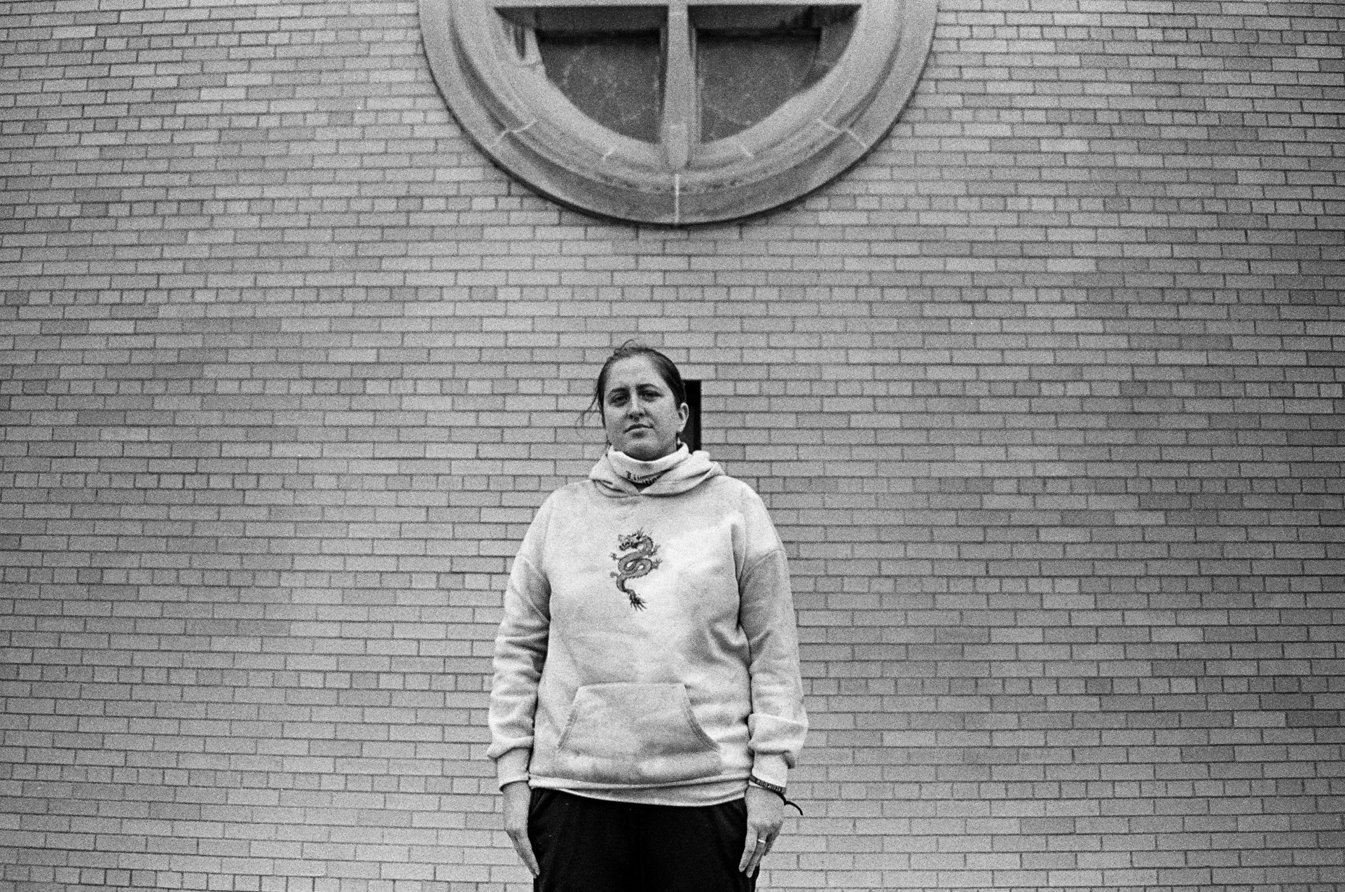 Eglė Malinauskaitė stands near the historic Lithuanian church in Chicago where they protested against the president Nausėda's LGBTQ policies.