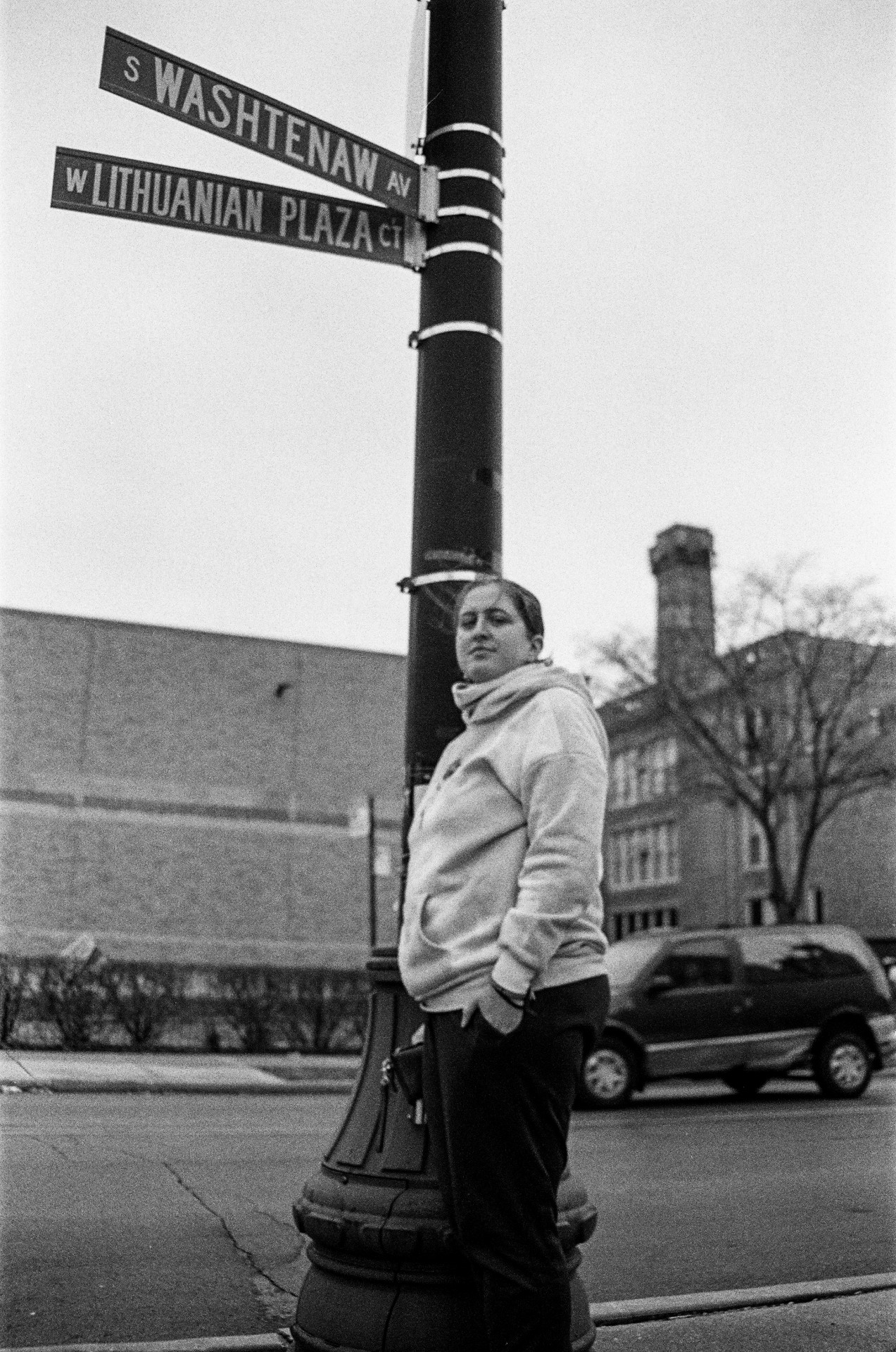 Eglė stands near the sign of Lithuanian Plaza street in Chicago.