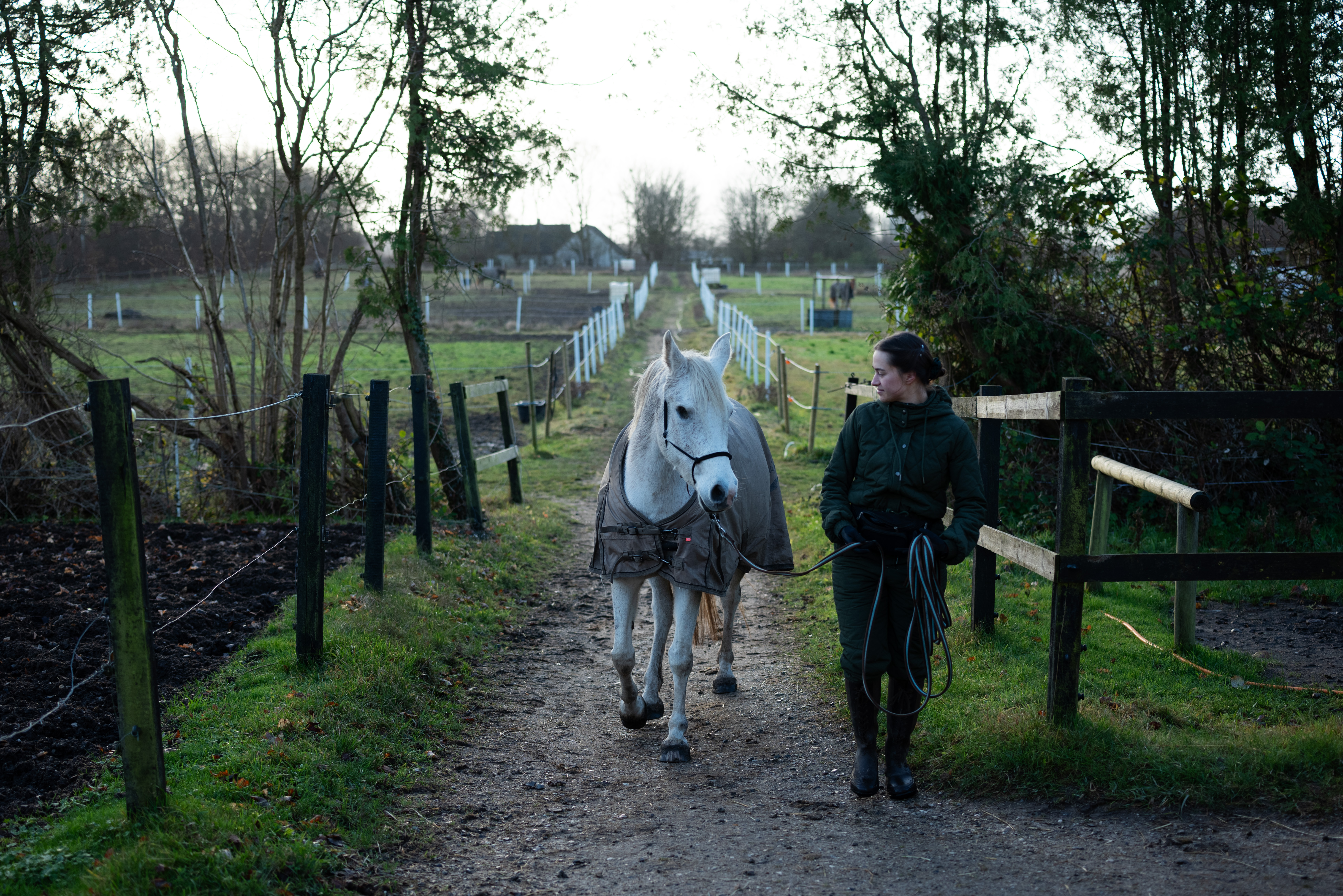 Aleksandra and her horse Pony. Both of them experience anxiety. They’re slowly walking to the training hall while taking deep breaths. ©Julija Stankevičiūtė