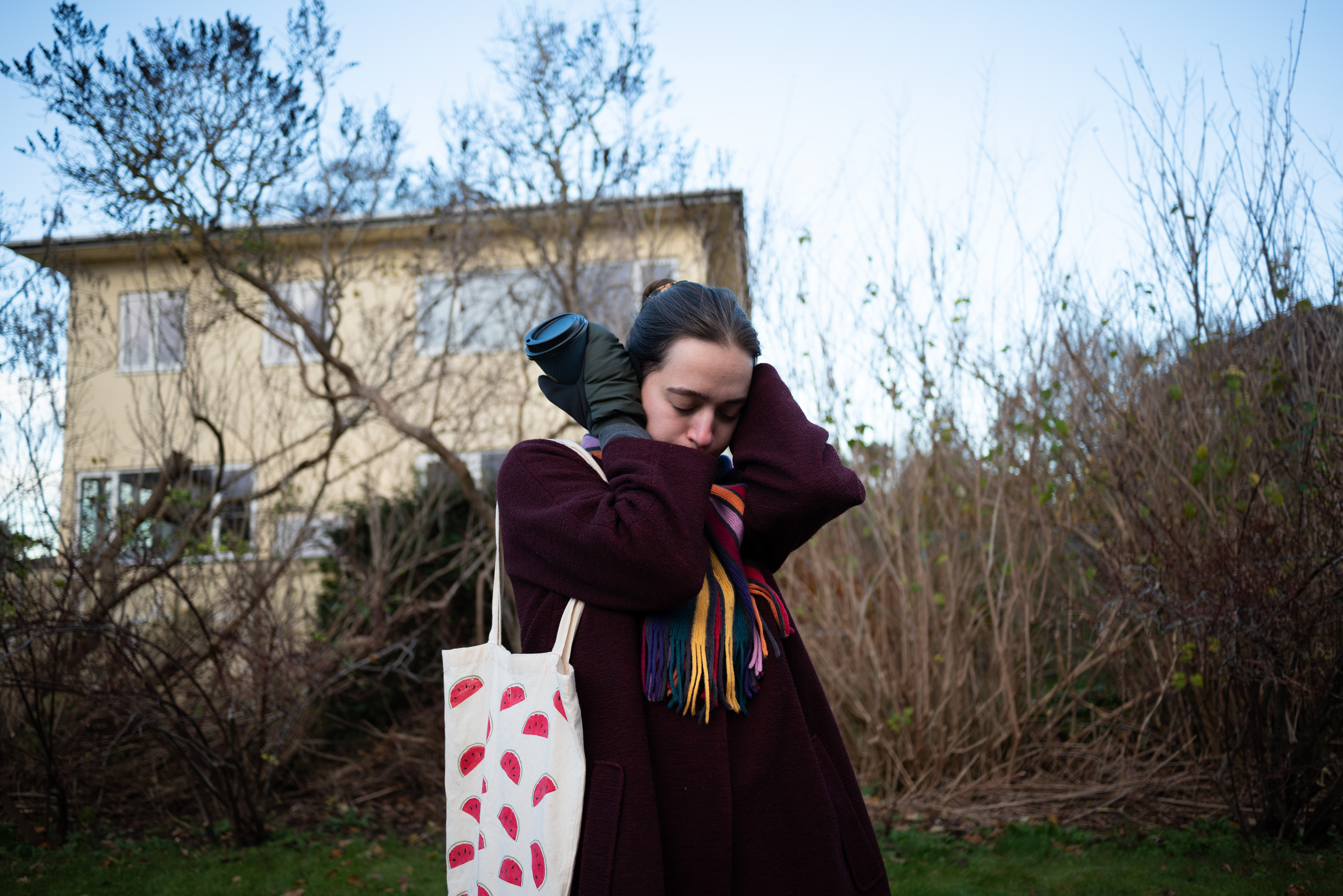 A helicopter passes above Aleksandra while she’s taking a walk. She waits it out. ©Julija Stankevičiūtė