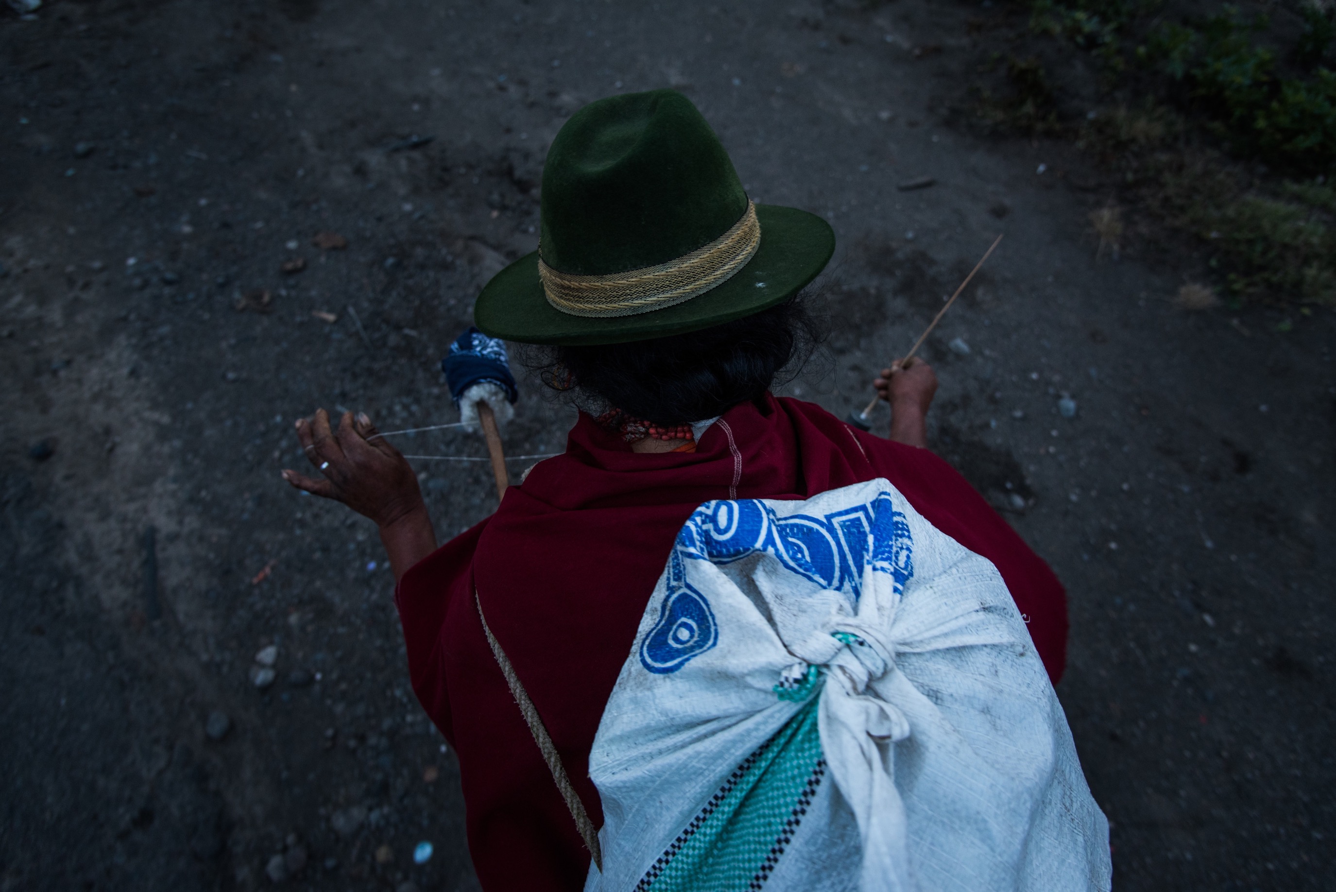 After animals are fed, women stach their bags with corn and head home to prepear dinner.