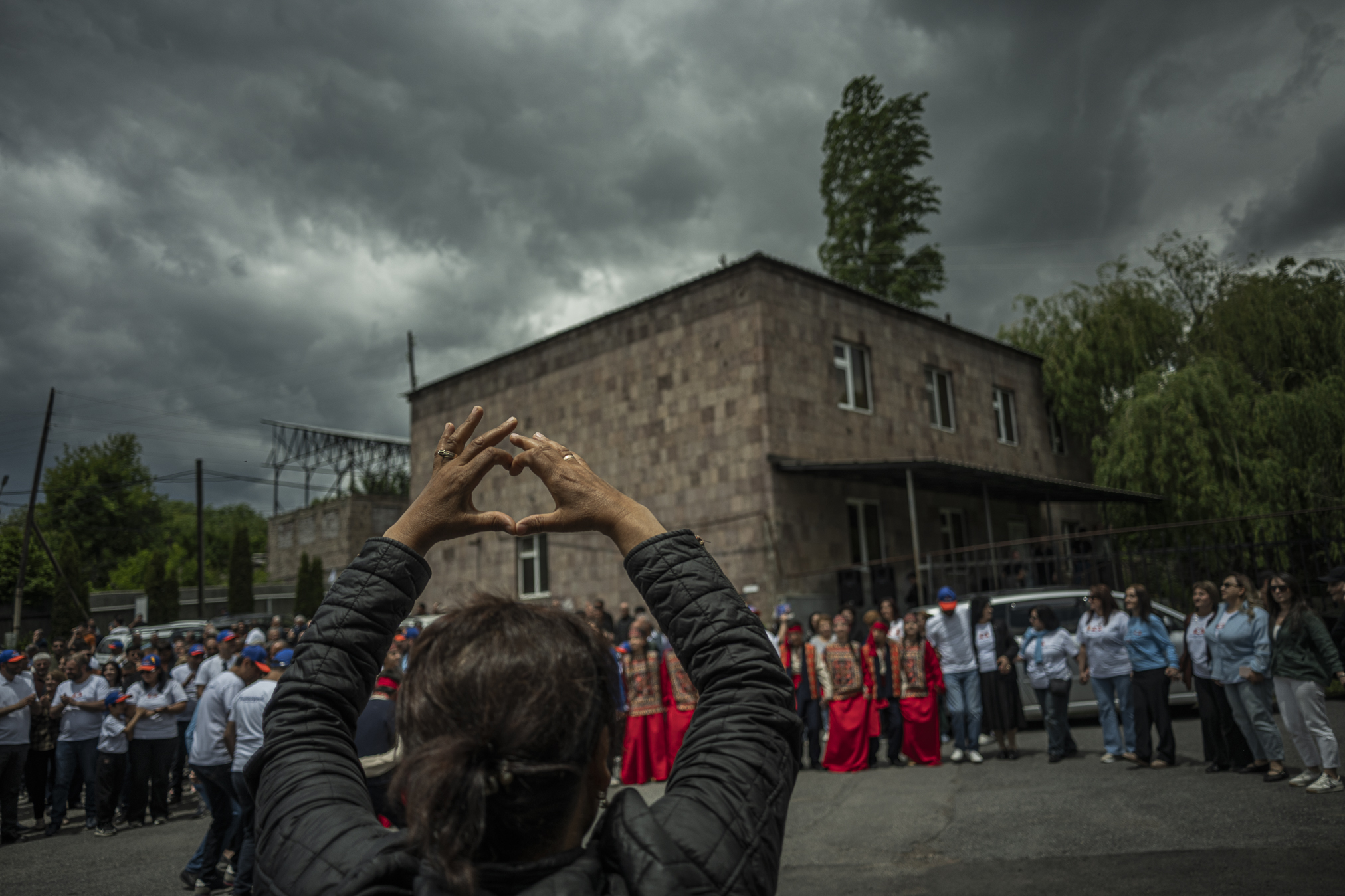 A rally of Pashinyan's Civil Contract party in the village of Byurakan in northern Armenia. One of the party's symbols is a heart shaped with the hands. ©Denis Vėjas