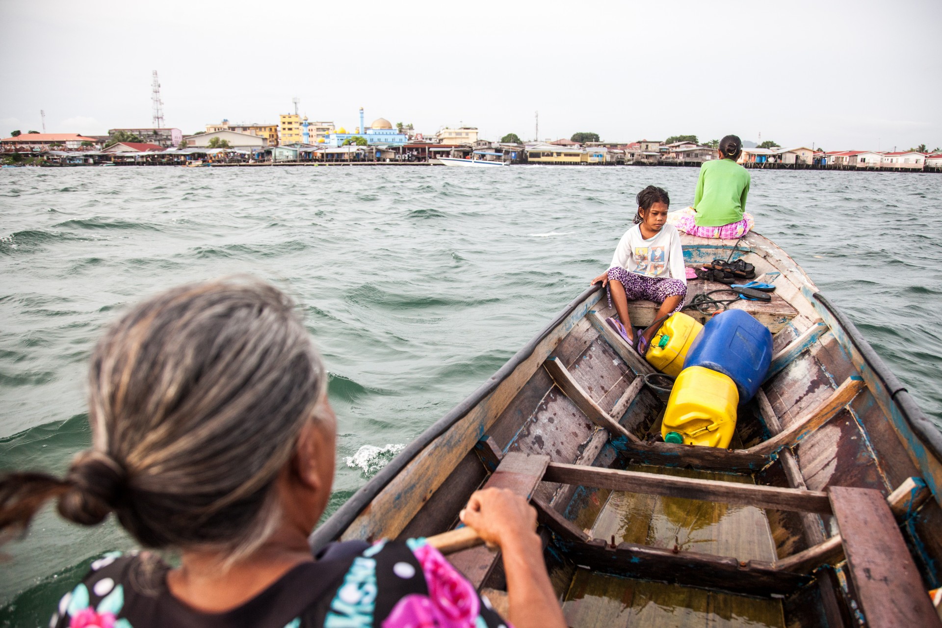 Batu, Shigesh and Siboto sail to the town of Semporna to get some water.