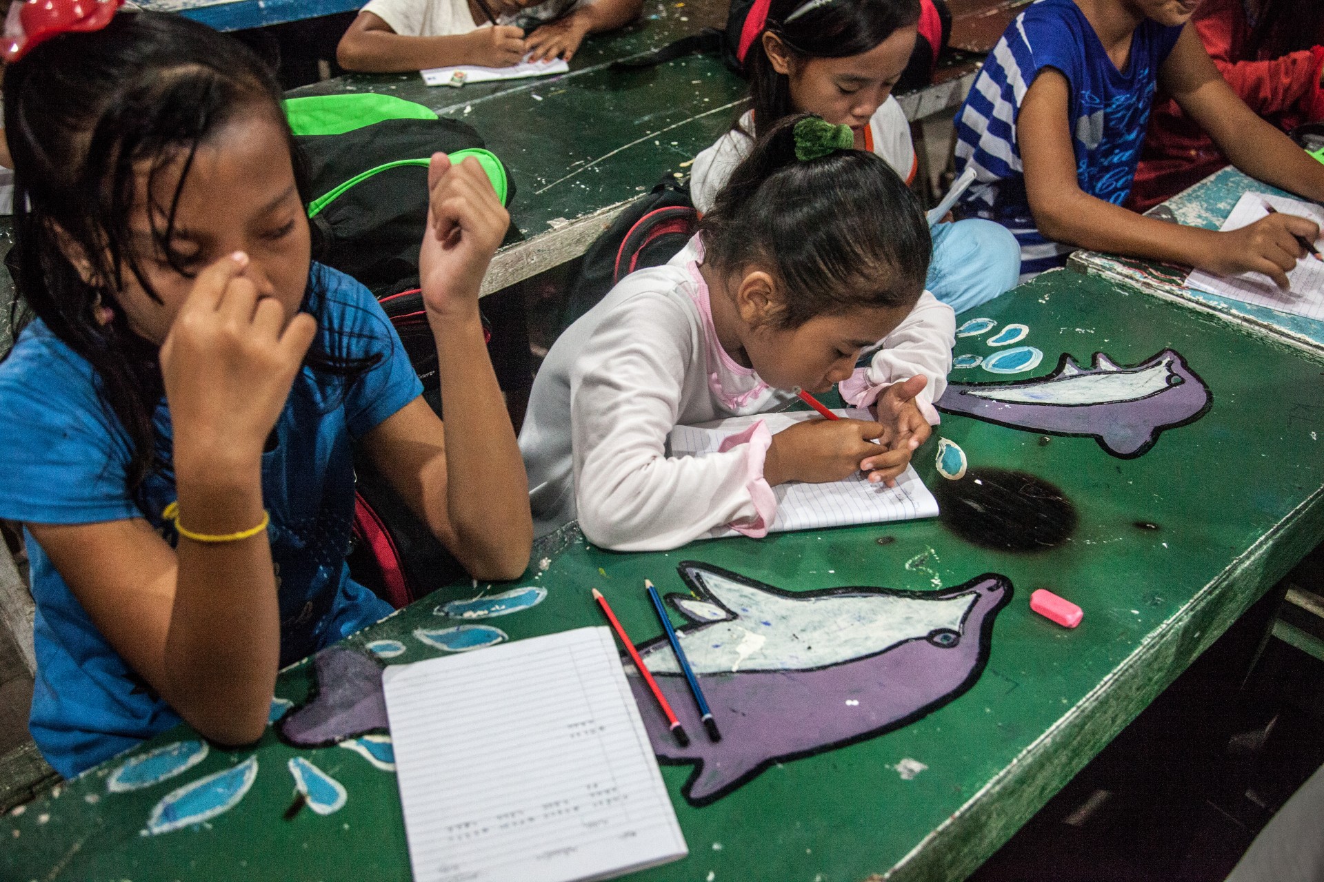 In the evenings, when the heat subsides, Mabul Island children gather at a school for undocumented Sama Dilaut offspring.