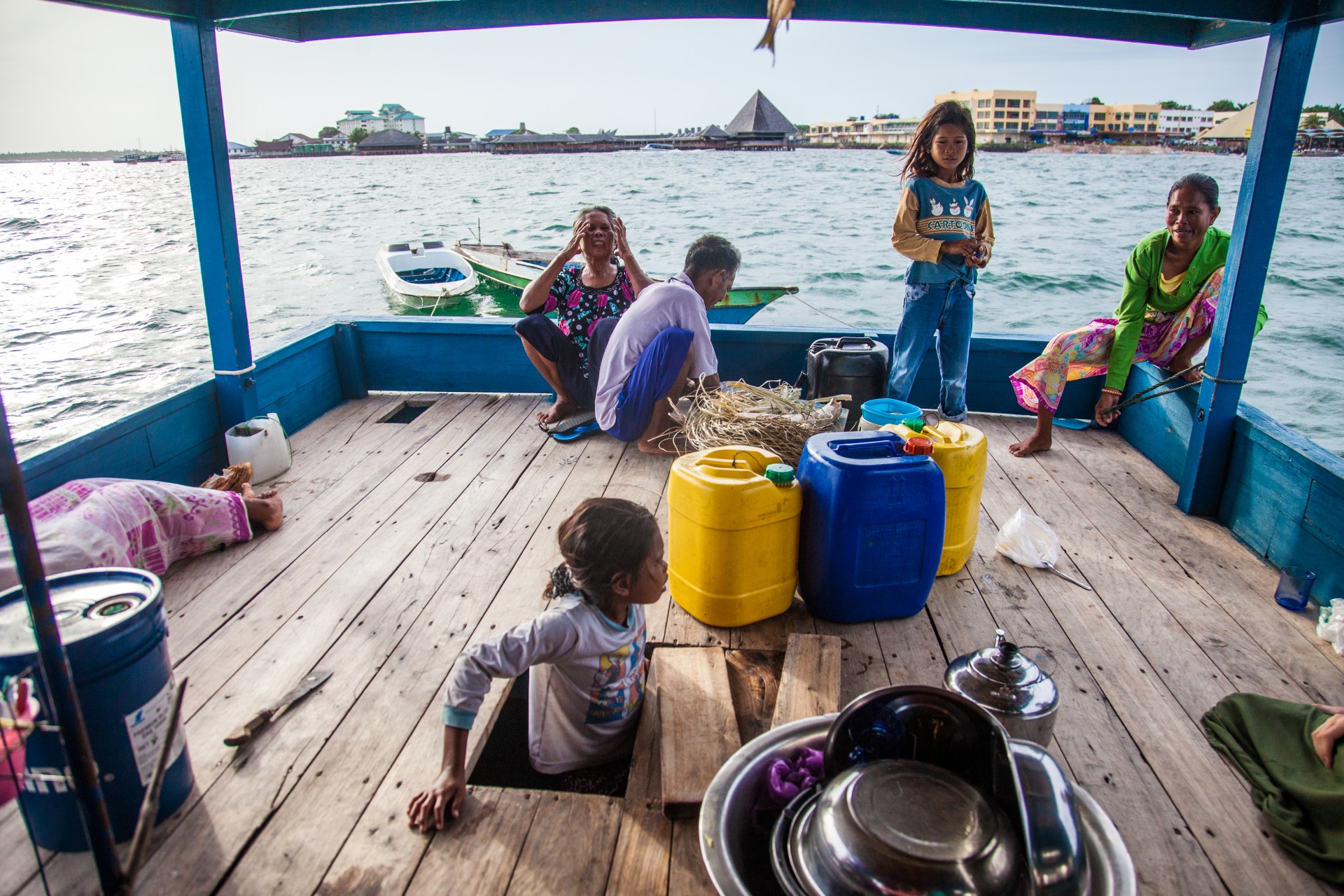 The back of the boat serves as a family kitchen and a bathroom.