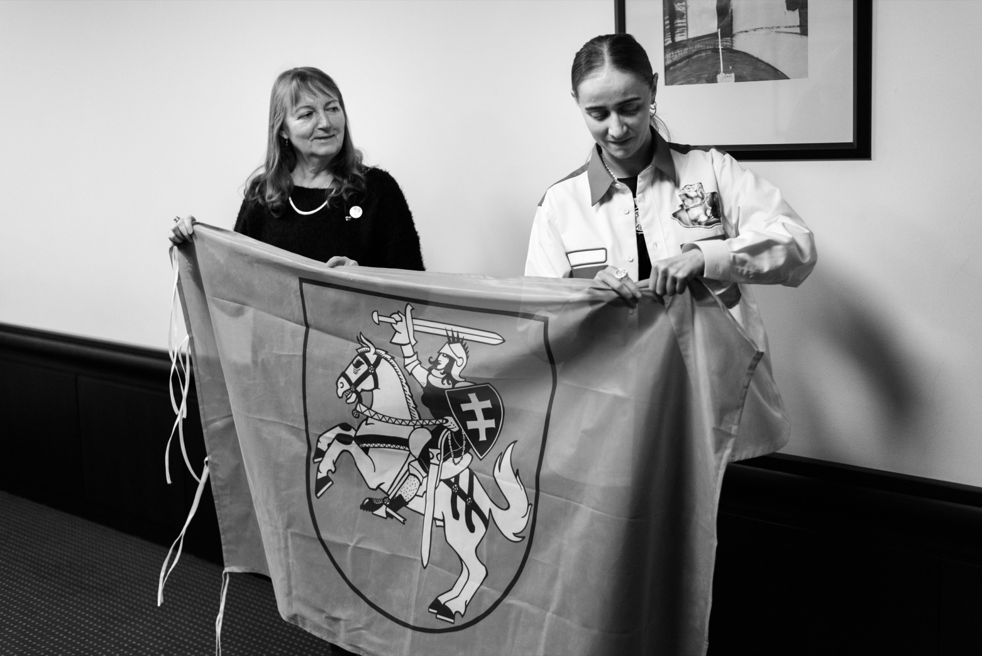 Silvana and Lilija raise Vytė, the flag of the Emancipation Day, the initiative to support Lithuanian women’s equality. They got it as the present from Lithuanian activists. ©Berta Tilmantaitė