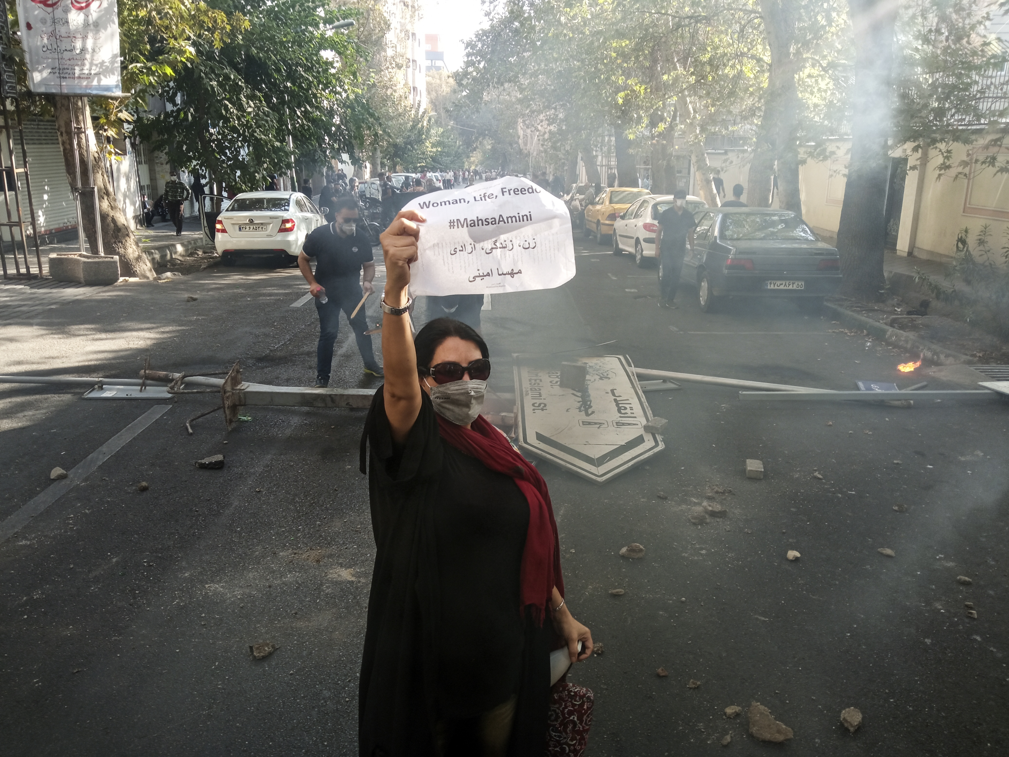 Iranians woman protests a 22-year-old woman Mahsa Amini's death after she was detained by the morality police, in Tehran, Saturday, Oct. 1, 2022. ©AP Photo/Middle East Images