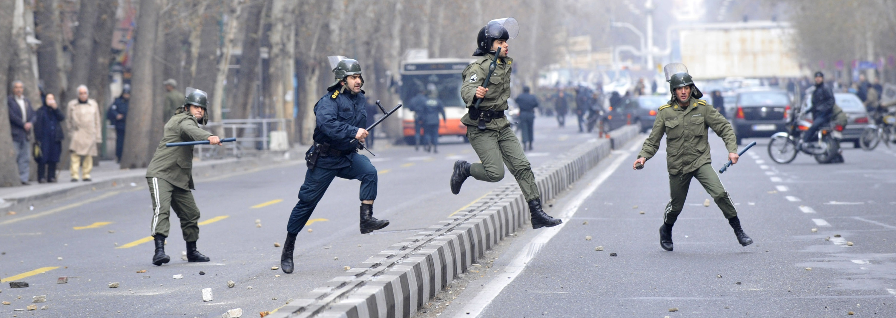Iranian anti-riot police officers following the protestors, during an anti-government protest in Tehran, Iran, Sunday, December 27, 2009 ©AP Photo