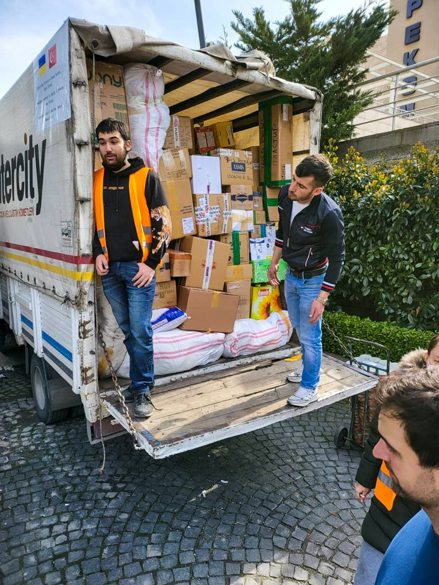 Now Maya is volunteering in a warehouse, where she is loading boxes full of aid to the trucks to Ukraine.