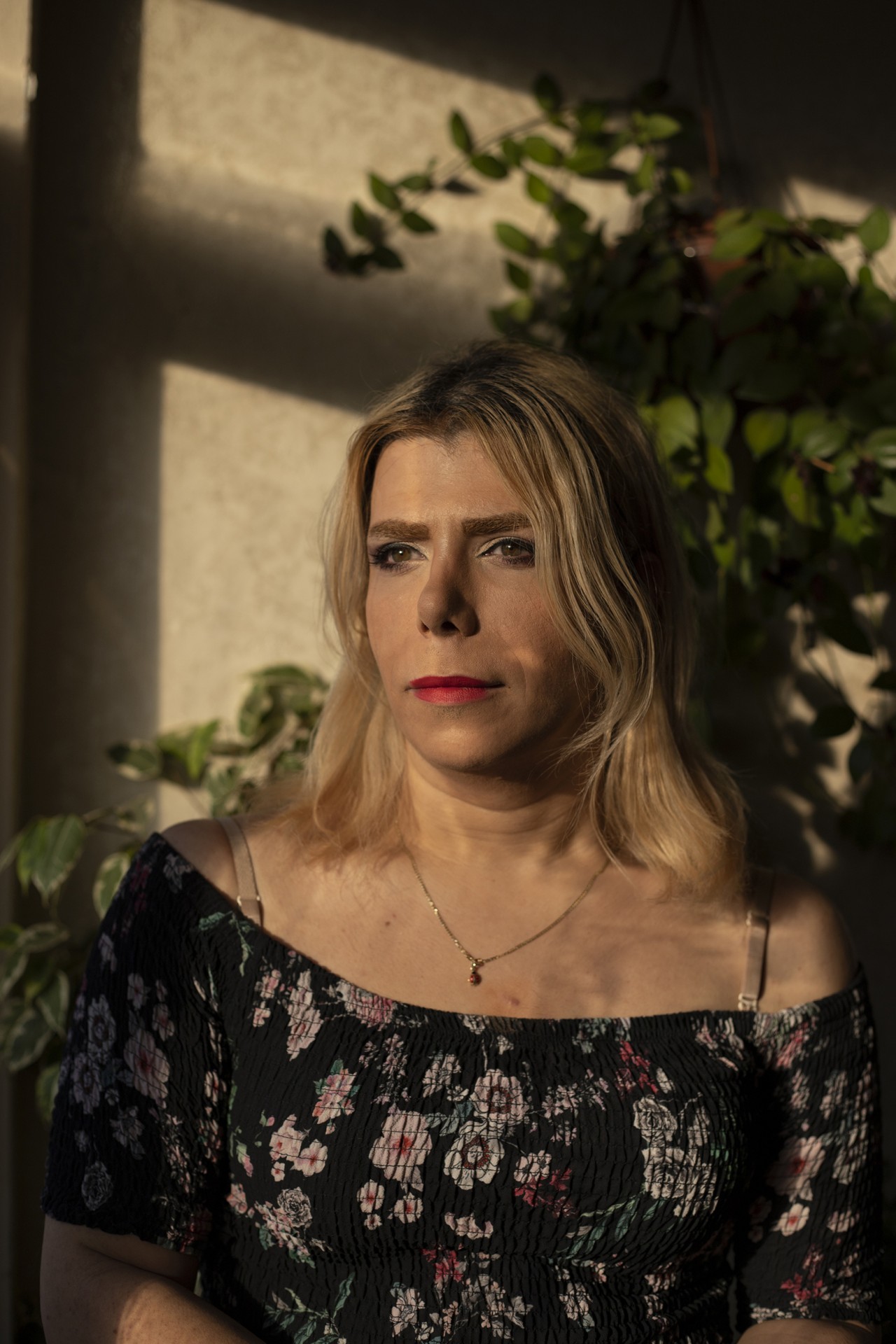 Baran poses for a portrait in her living room in Turkey.