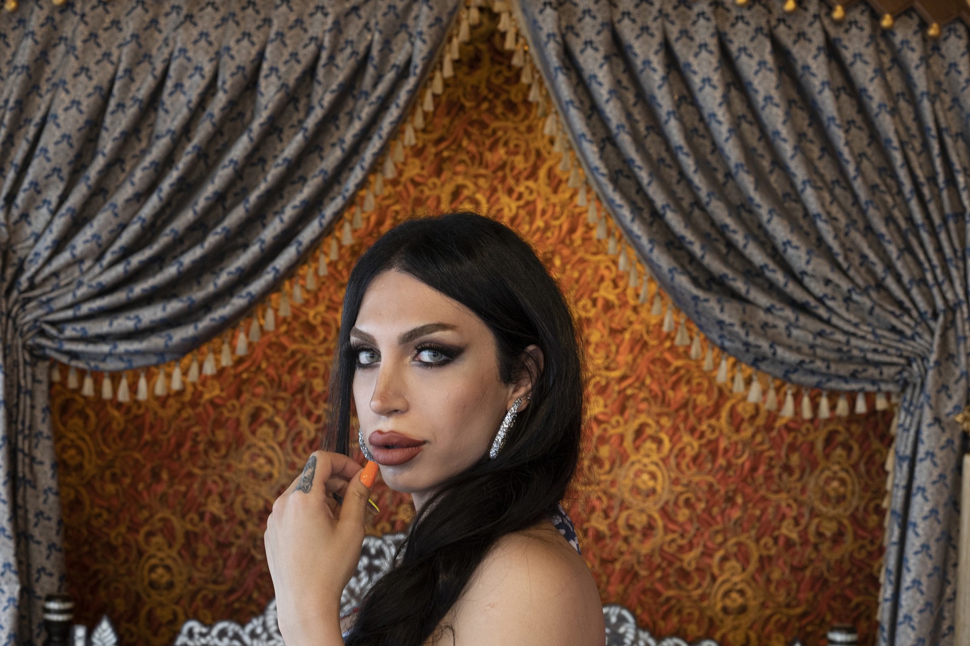 Haleh poses for a portrait in a photography studio in Istanbul.