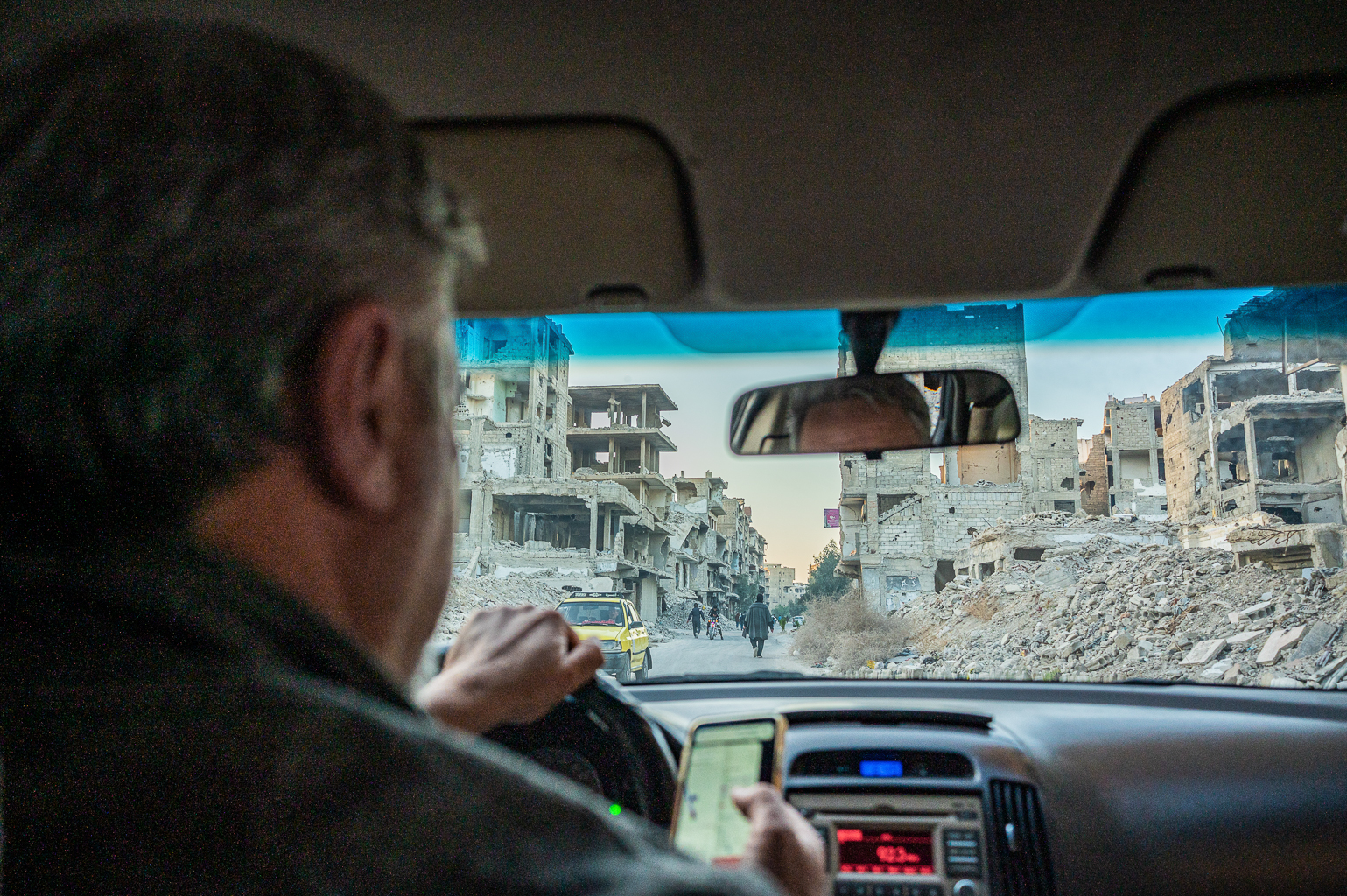 Yarmouk, palestiniečių rajonas Damaske, Sirijoje. Vaizdas pro taksi langą. ©Denis Vėjas